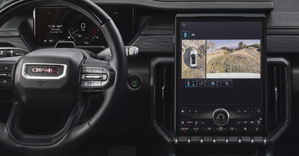 The steering wheel and infotainment system of the 2025 GMC Acadia